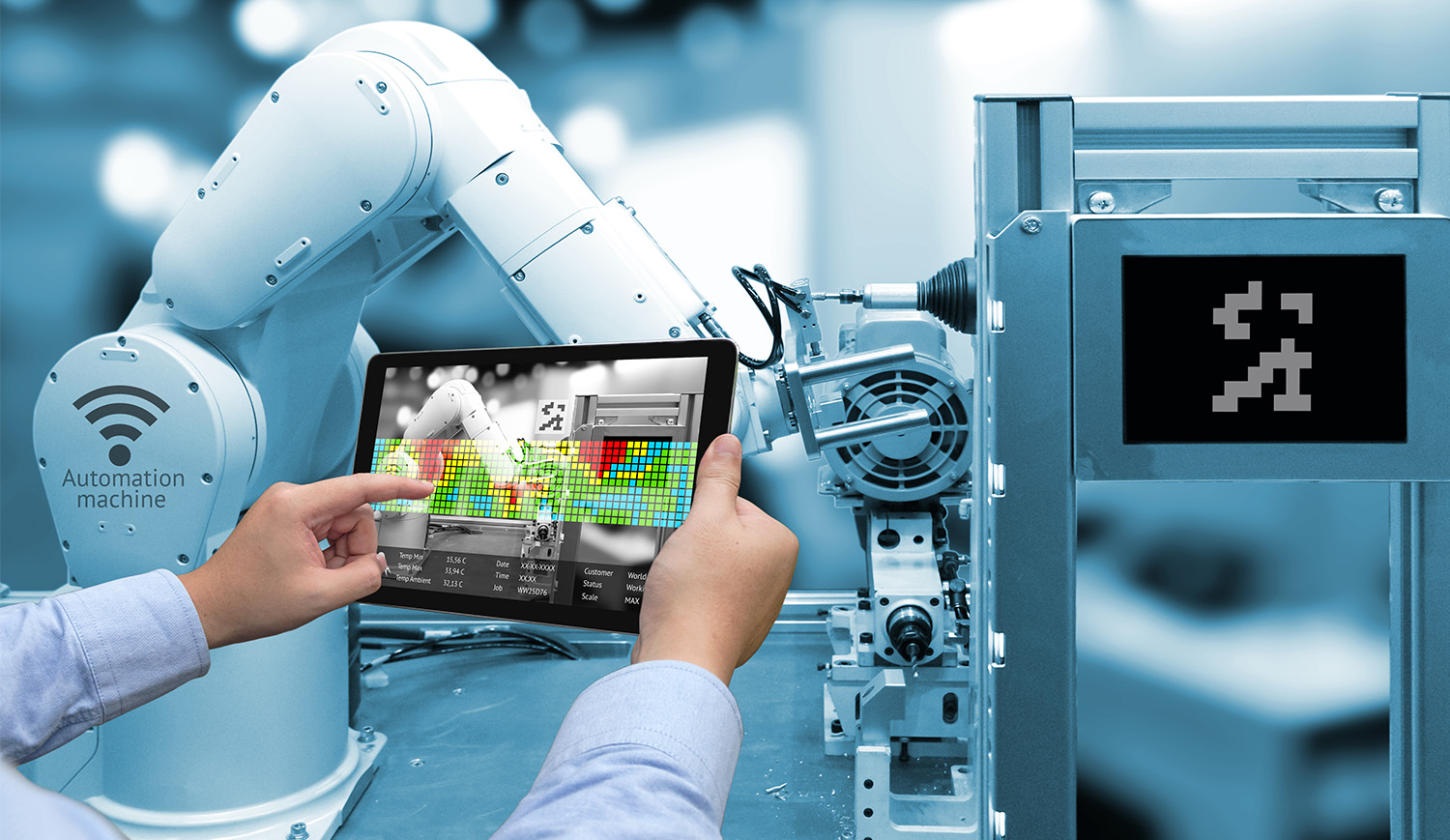 robot factory person operating tablet