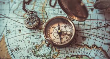 hero history antique compass on map