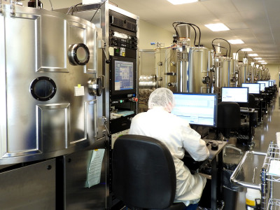 technician in coating chamber